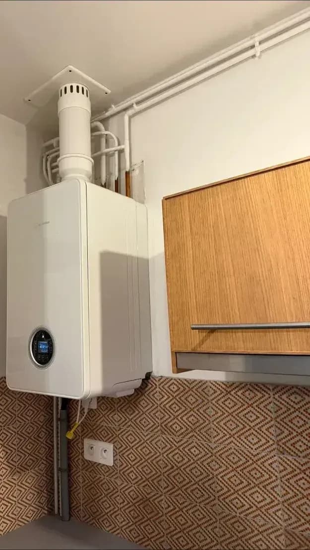 Modern wall boiler with display installed in a kitchen